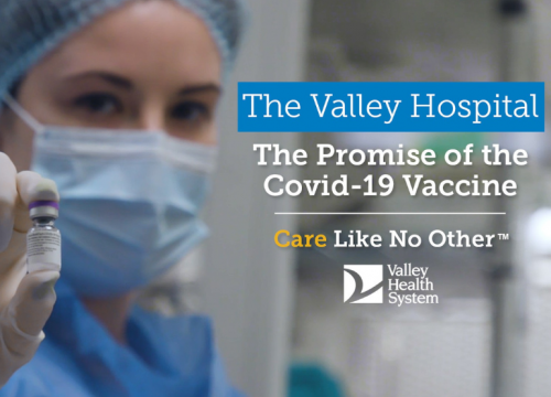 nurse holding covid-19 vaccine