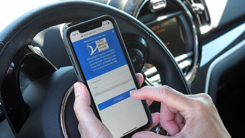 Patient using Valley Medical Group's text chat to talk to office staff from their car