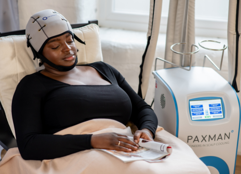 woman receiving paxman scalp cooling treatment