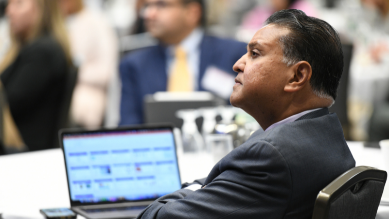 Dr. Mittal watching presentation