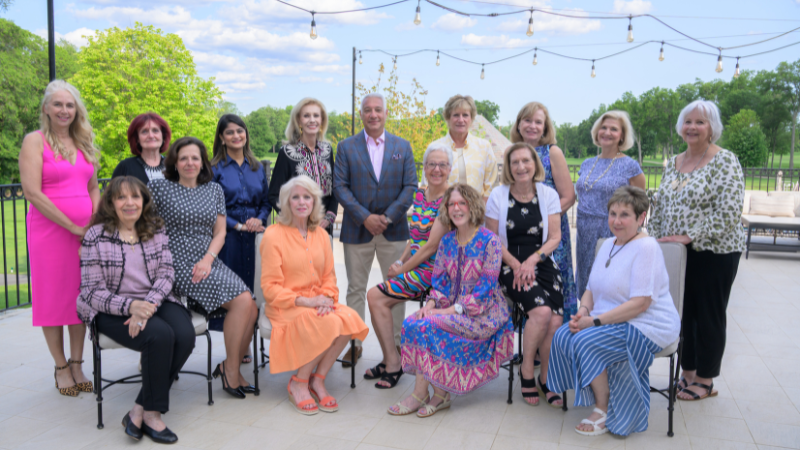group of people posing for photo at golf outing event