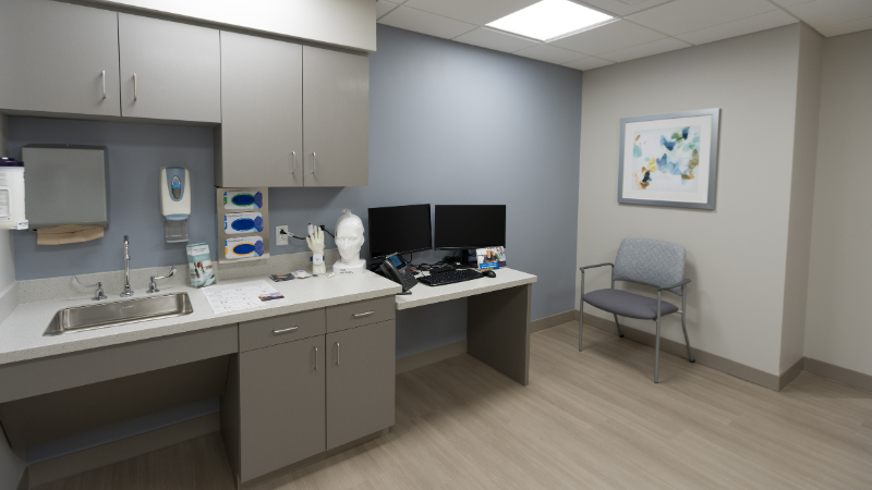 sleep center patient room with chair and sink