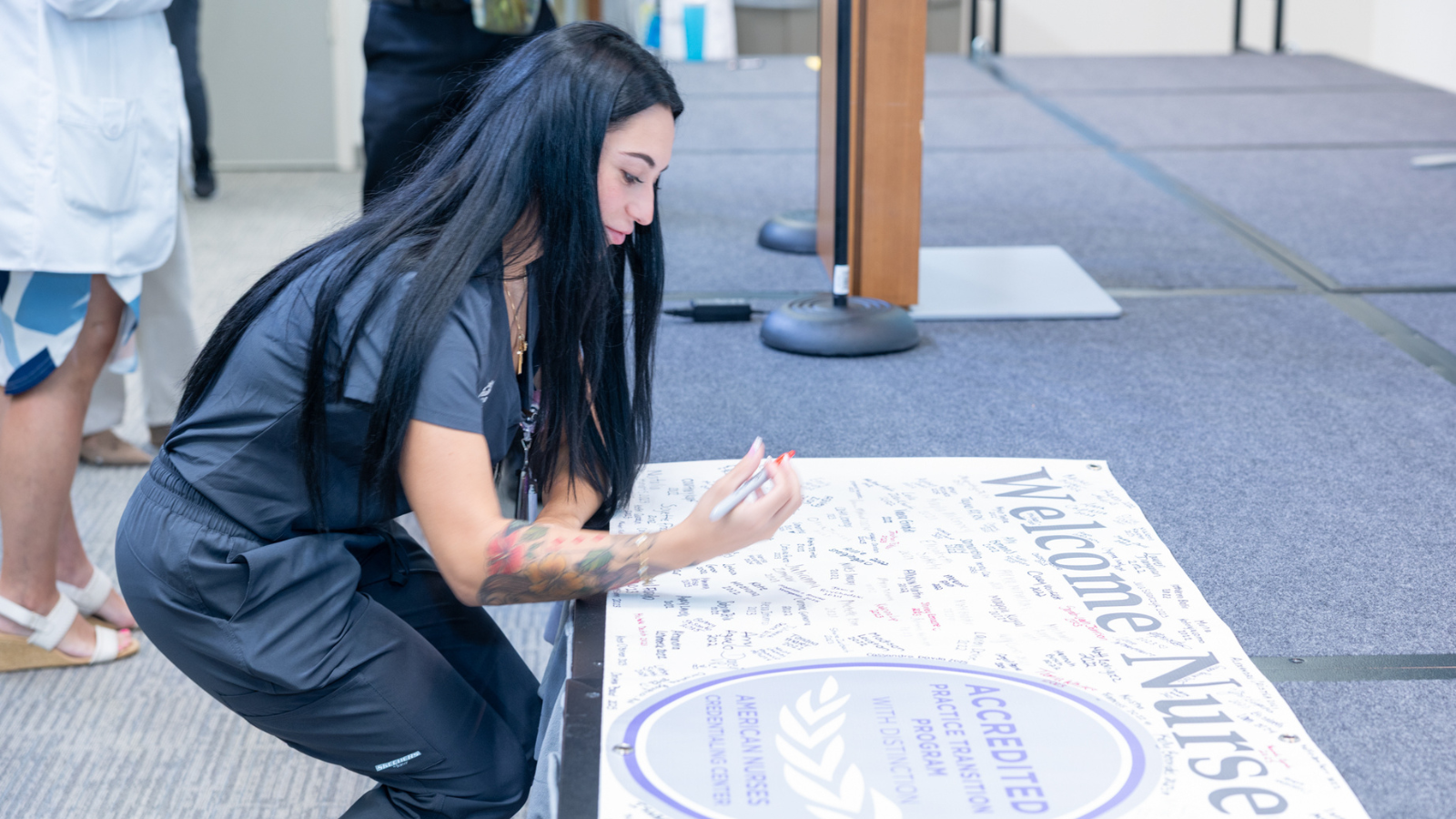 nurse working on a poster presentation
