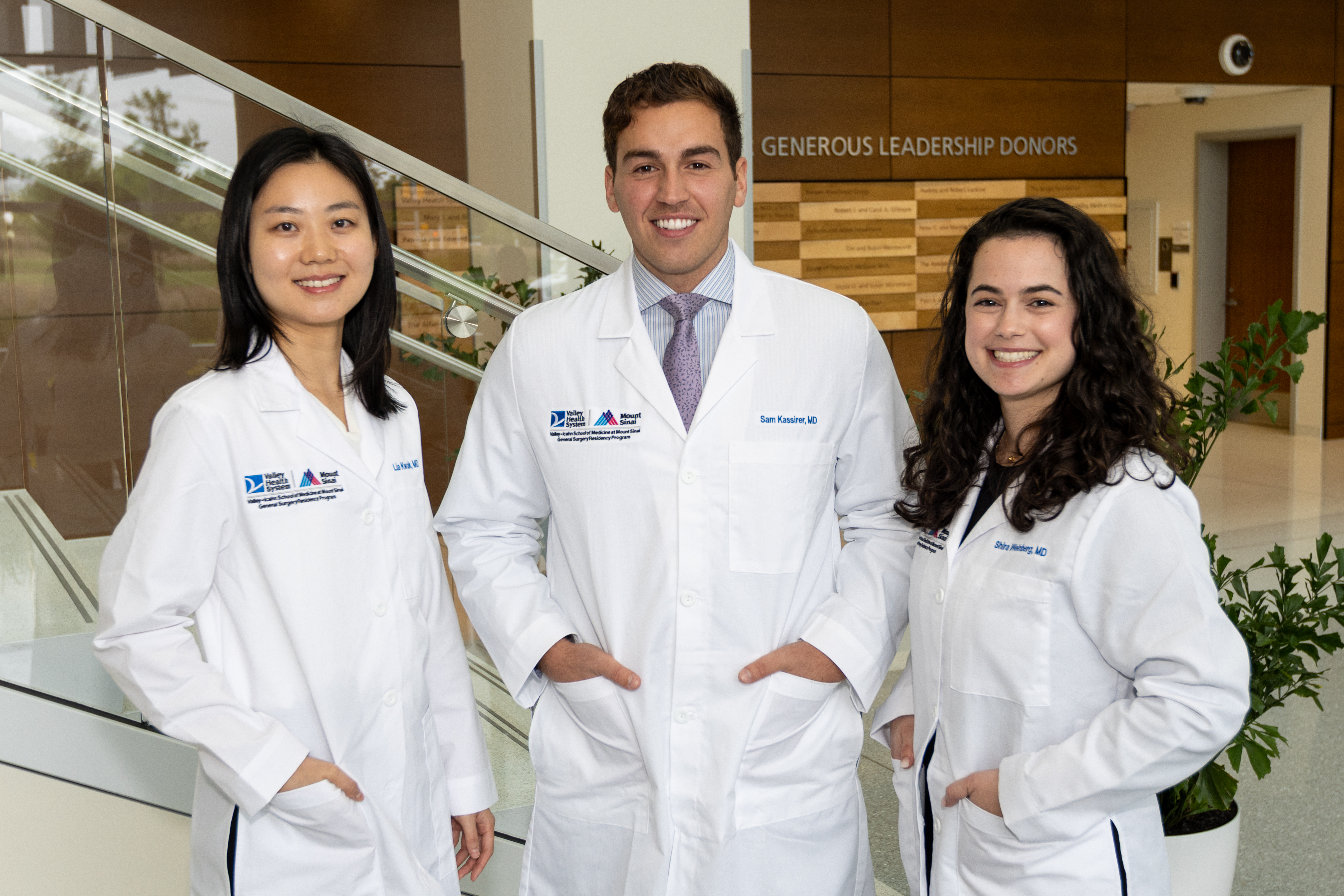 group of surgery residents standing in lobby of the hospital