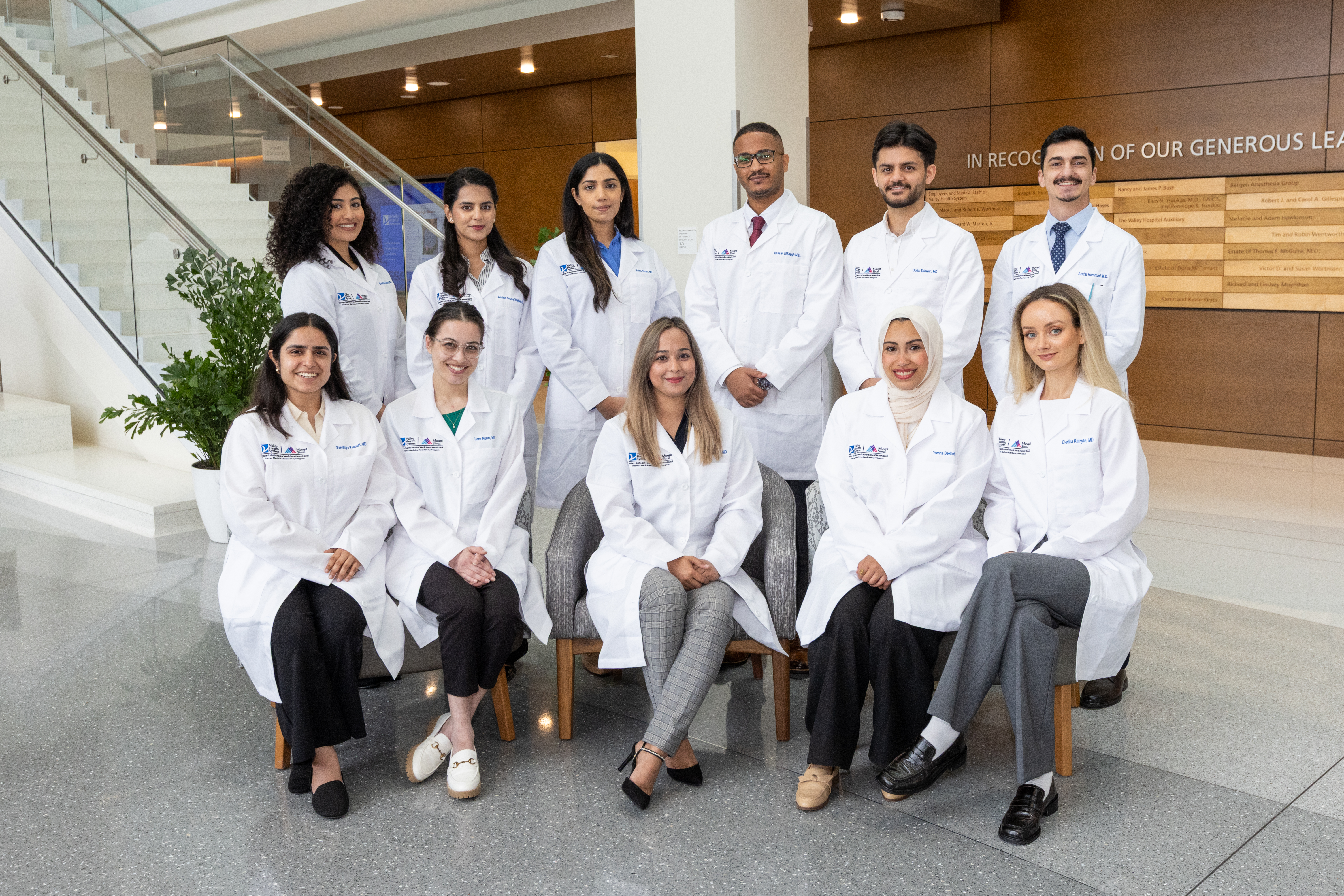 group of internal medicine resident doctors in the lobby of a hospital