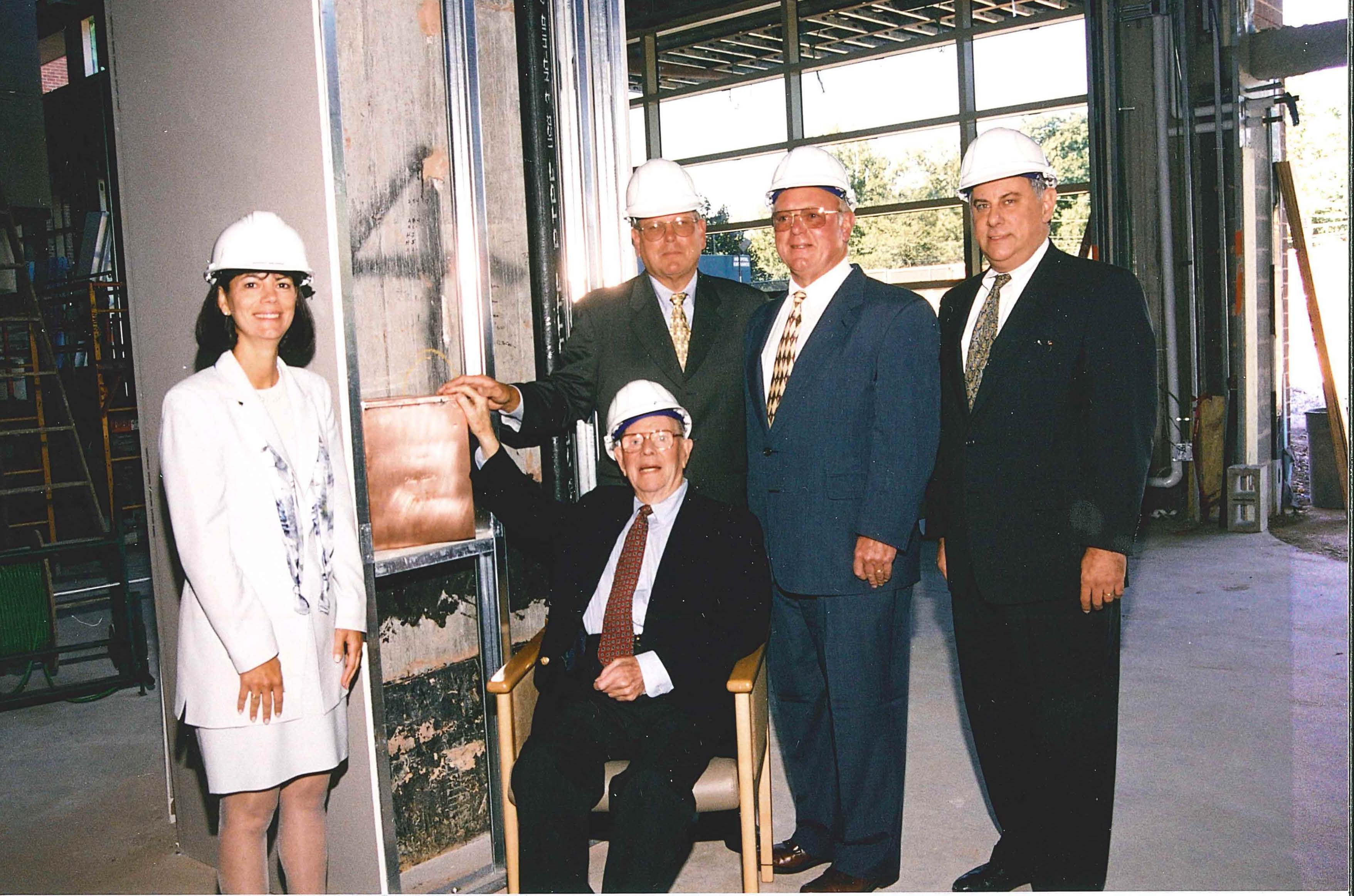 Valley staff placing a time capsule to mark the millennium