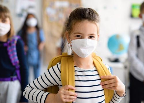 girl in school, wearing facemask