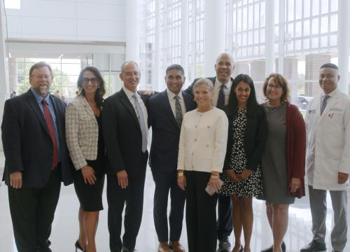group of valley executives pose for a photo with senator cory booker