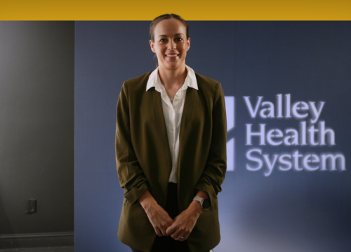 Dr. Cecilia Godoy standing being interviewed