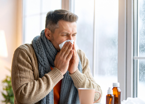 man sneezing
