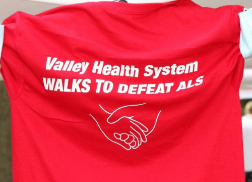 tshirt that says "Valley Health System Walks to Defeat ALS"