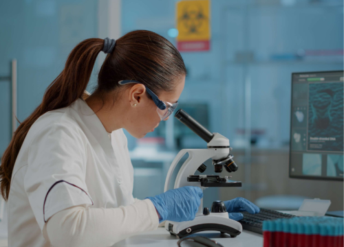 scientist working with a microscope 