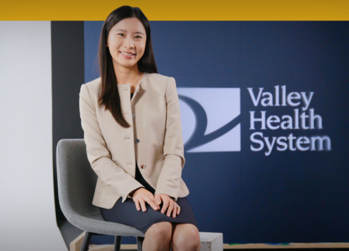 Stacey Pan, MD sitting being interviewed