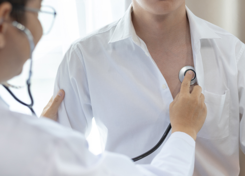 doctor listening to a patient's heart