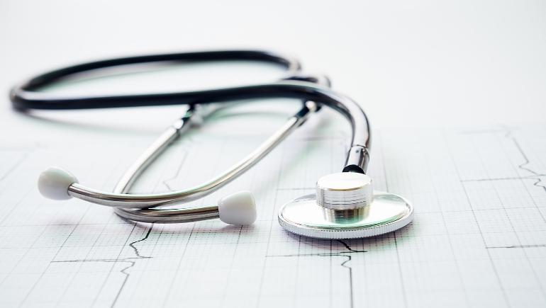 black stethoscope on white table