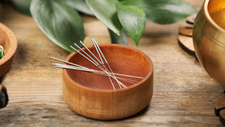 acupuncture needles in a bowl