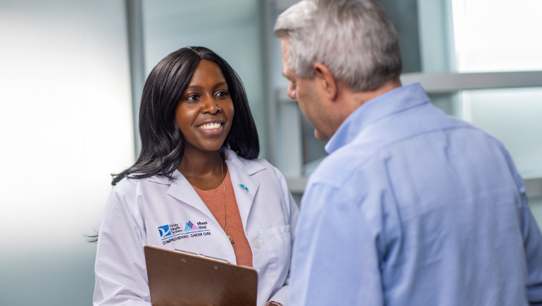 doctor smiling talking to patient