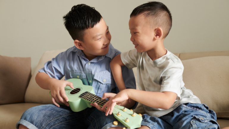 two brothers smiling and playing together