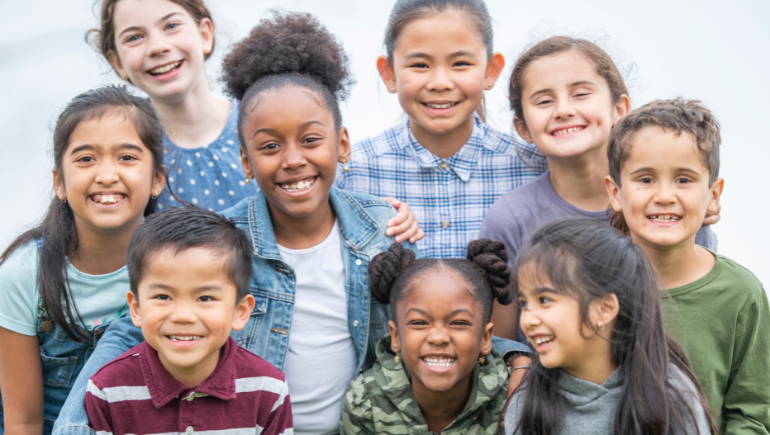 children in a group smiling