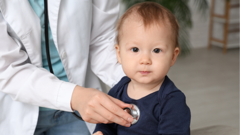 baby being examined by a pediatrician