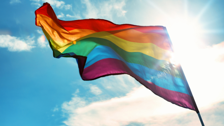 LGBTQ+ flag flying in the sky