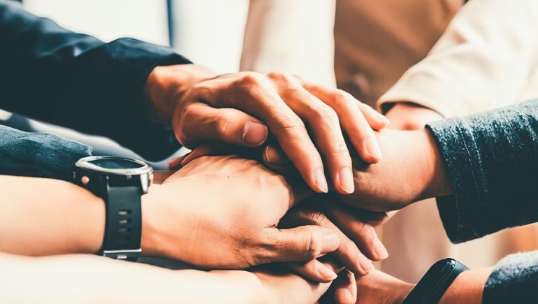 people holding hands in comfort