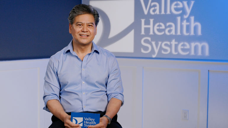 edward yatco, md, sitting, being interviewed