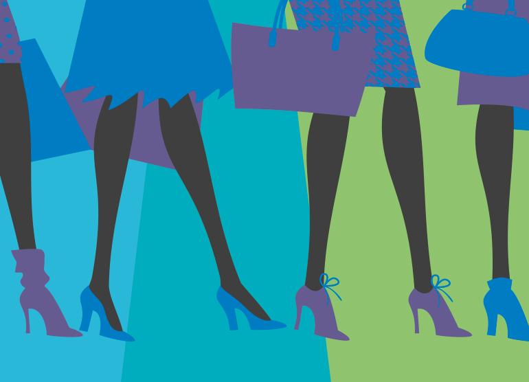 Female shoppers walking with shopping bags