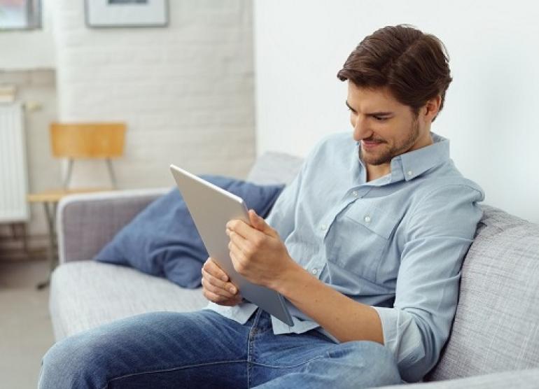 man using tablet to speak to a doctor