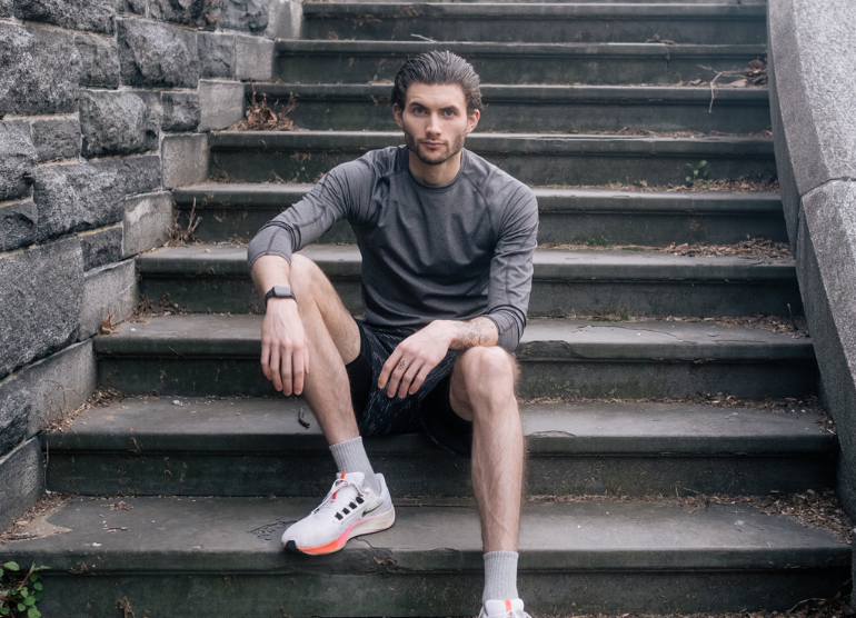 chris sitting on stairs