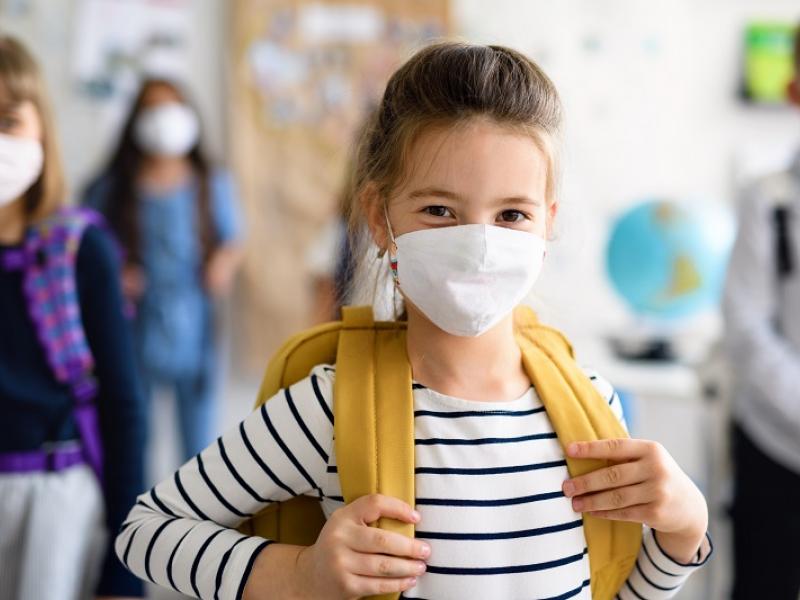 girl in school, wearing facemask