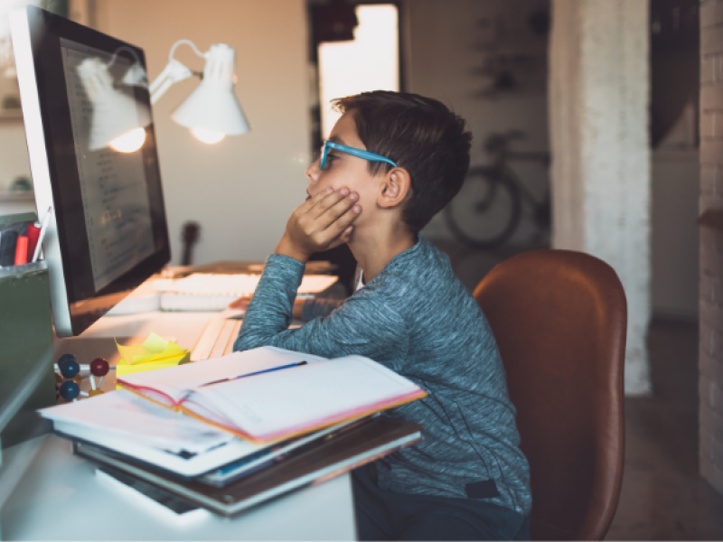 boy doing schoolwork at home