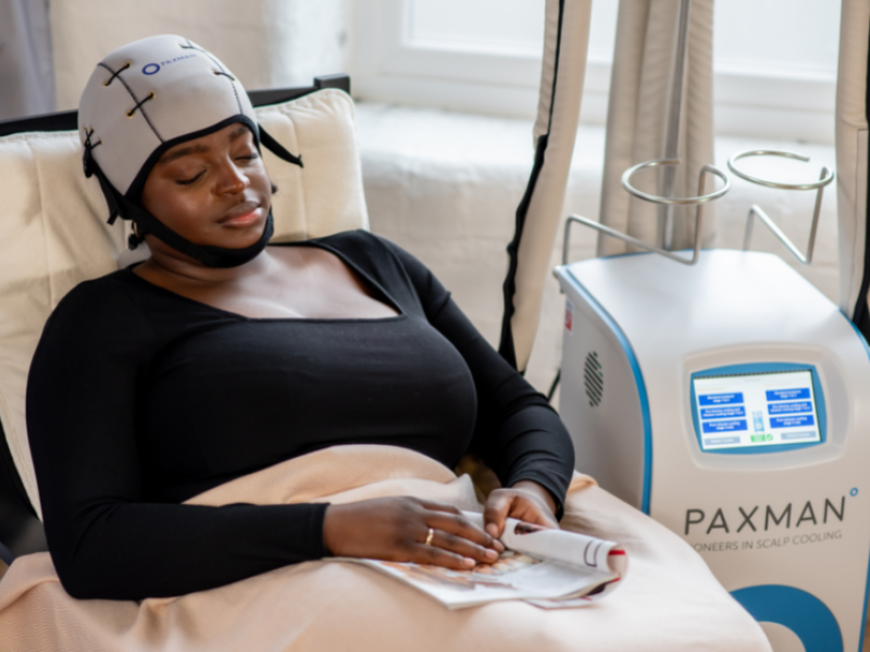 woman receiving paxman scalp cooling treatment
