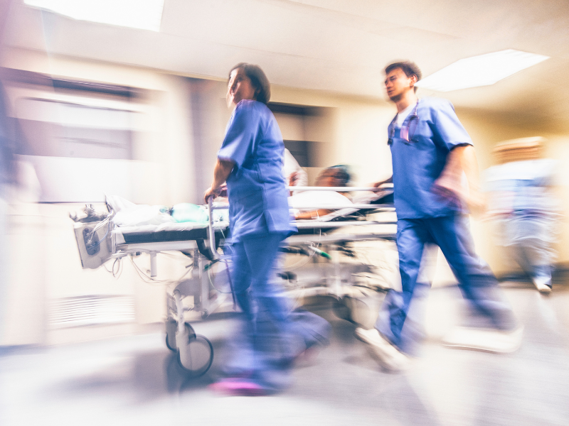 emergency department providers running with a stretcher