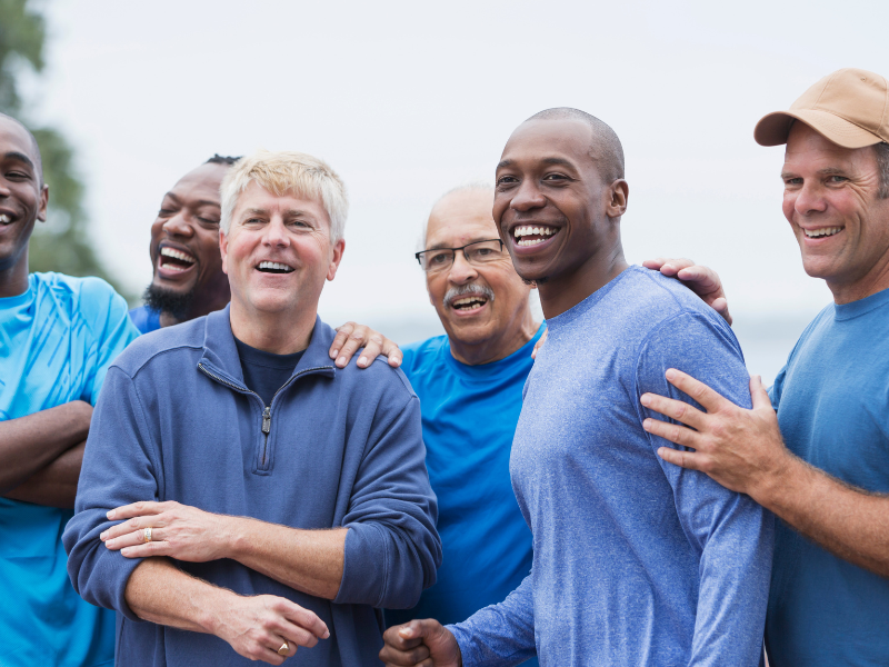 group of healthy, diverse men smiling