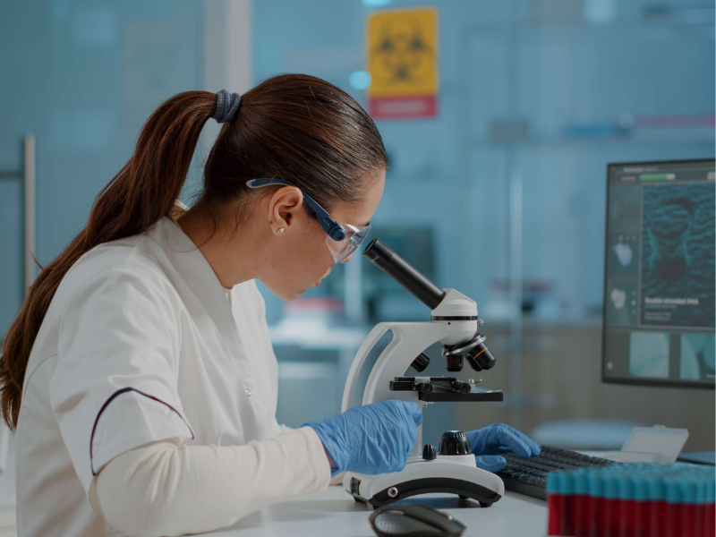 scientist working with a microscope 