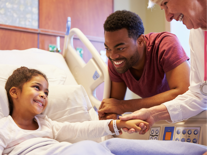 dad with daughter after pediatric surgery at the hospital