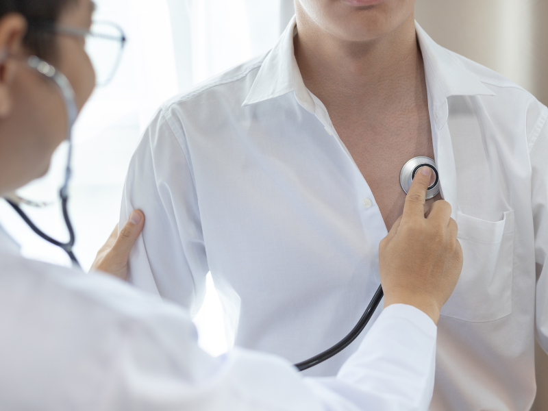 doctor listening to a patient's heart