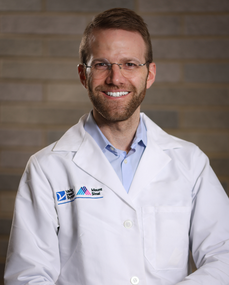 John J. Tackett, MD